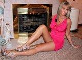 1638930-milf-seated-pantieless-in-front-of-fireplace.jpg