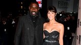 idris-elba-dons-a-coat-while-gemma-arterton-braves-the-cold-at-100-streets-premiere-1364111499...jpg