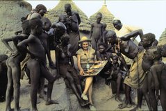 leni riefenstahl showing her latest book to nubian tribespeople.jpg